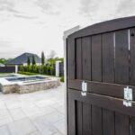 Courtyard door opening to a custom rectangle swimming pool