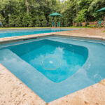Sunken gunite spa with natural stone coping in Lafayette, LA