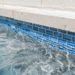 Glass water line tile in a custom swimming pool in Lafayette, LA