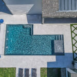 Custom swimming gunite swimming pool with water feature wall, tanning ledge in Lafayette, LA