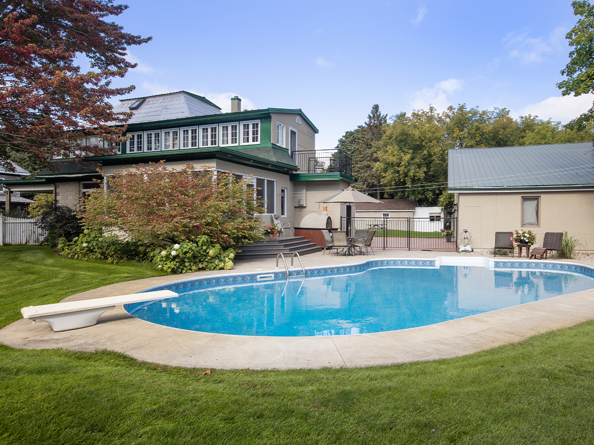 Circular pool in a large backyard.