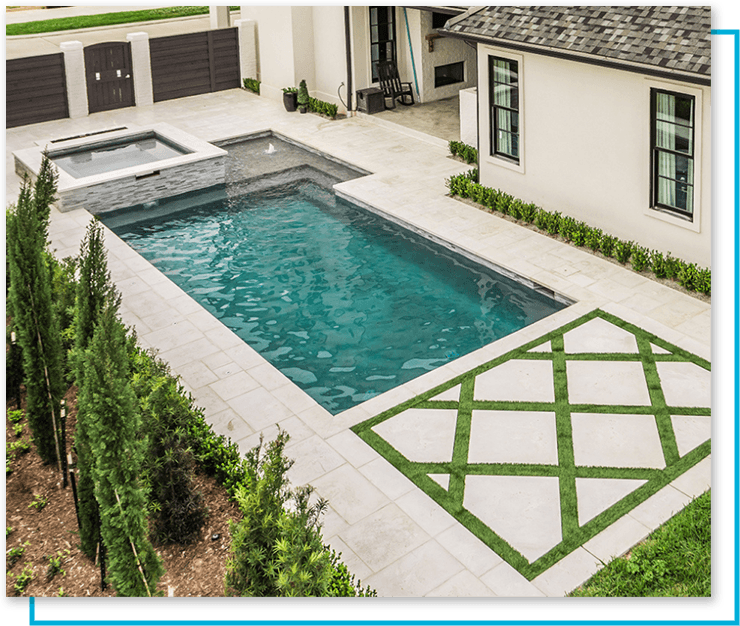 A pool with greenery around it