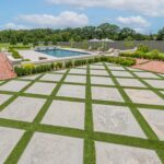 Custom swimming pool in Lafayette, LA, Turf inlay with pavers