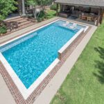 Rectangle custom inground swimming pool with natural stone coping | Lafayette, LA