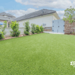 Stylish custom backyard pool with built-in umbrella, tanning ledge by Bask Pools in Lafayette, LA