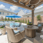 Stylish custom backyard pool with built-in umbrella, tanning ledge by Bask Pools in Lafayette, LA