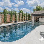 Complete pool renovation with fire and water feature, tanning ledge and modern finishes by Bask Pools – expert pool remodeler in Lafayette, LA